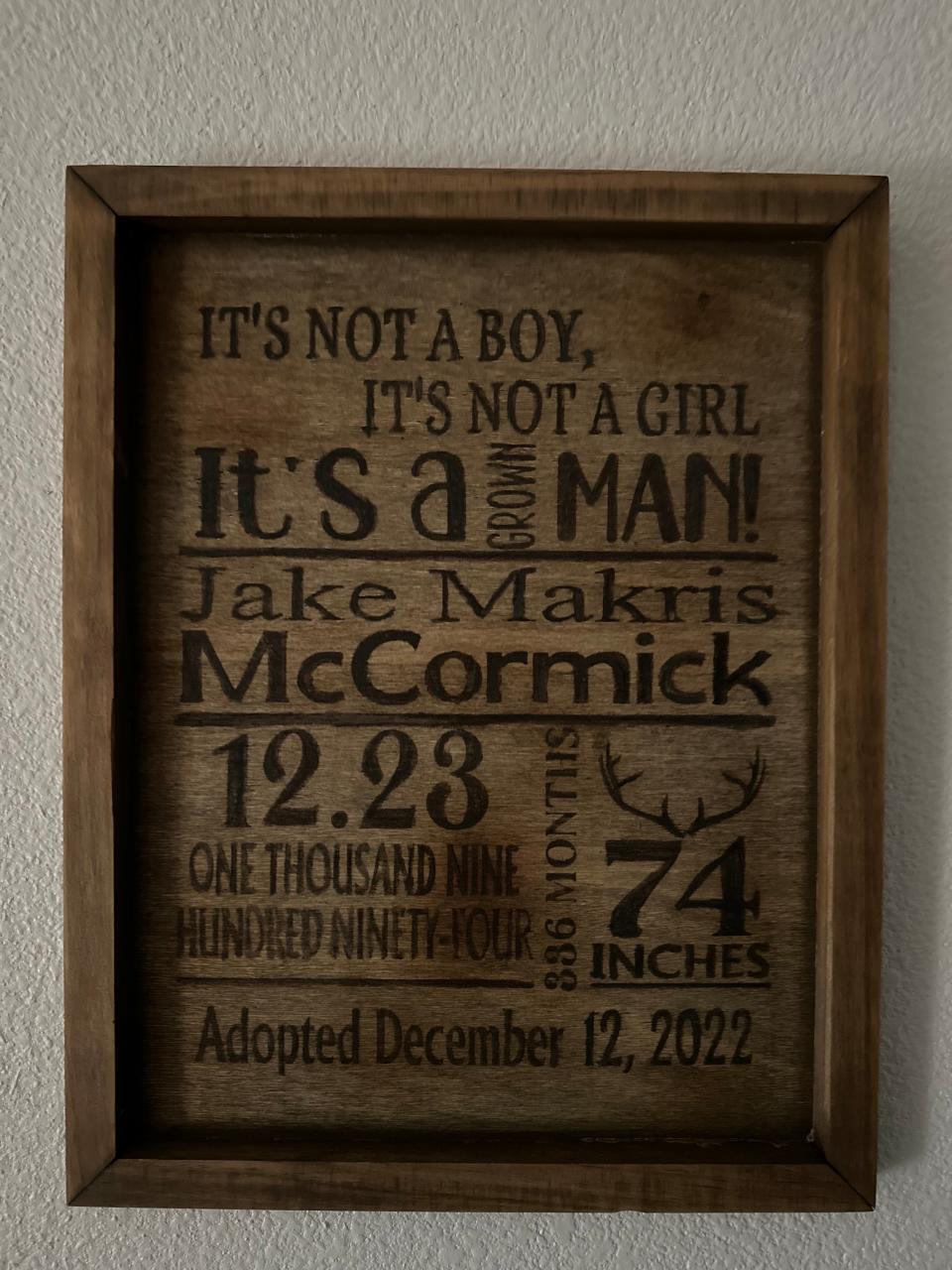 One of the gifts was a wood-burned plaque styled like a birth announcement. It read: "It's not a boy, it's not a girl, it's a grown man!"