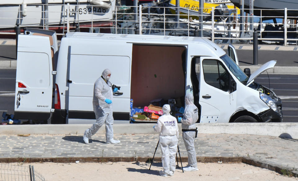 <p>French forensic police officers take images as they search a vehicle following a car crash in the southern Mediterranean city of Marseille on Aug. 21, 2017. (Photo: Bertrand Langlois/AFP/Getty Images) </p>