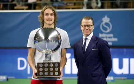 Tennis - ATP Stockholm Open - Men's Single Final - Stockholm, Sweden - October 21 2018. Stefanos Tsitsipas of Greece poses with his trophy next to Sweden's Prince Daniel after winning the ATP Stockholm Open tennis tournament men's single final against Ernests Gulbis of Latvia (not pictured). TT News Agency/Soren Andersson/via REUTERS