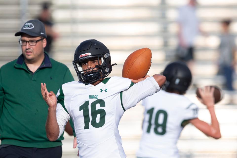 Palmetto Ridge's Demetri Zertopoulis (16) throws a pass during the warmup of the FHSAA non-district football game between Palmetto Ridge and Barron Collier, Friday, Sept. 2, 2022, at Barron Collier High School in Naples, Fla.