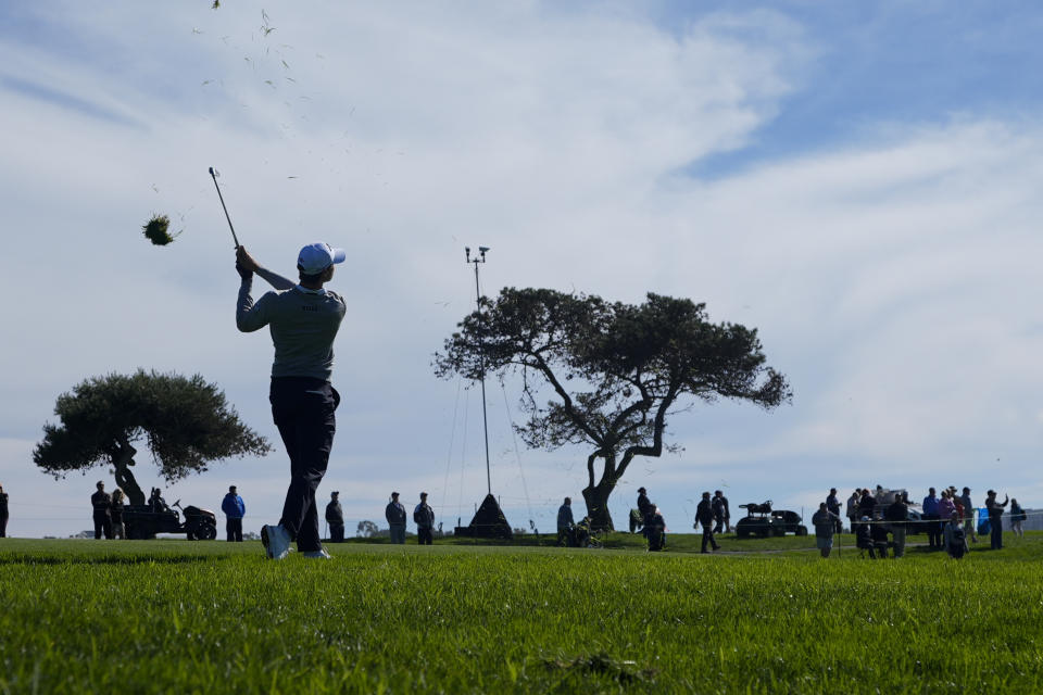 Thomas Detry watches his second shot on the second hole of the Sorth Course at Torrey Pines during the third round of the Farmers Insurance Open golf tournament, Friday, Jan. 26, 2024, in San Diego. (AP Photo/Gregory Bull)
