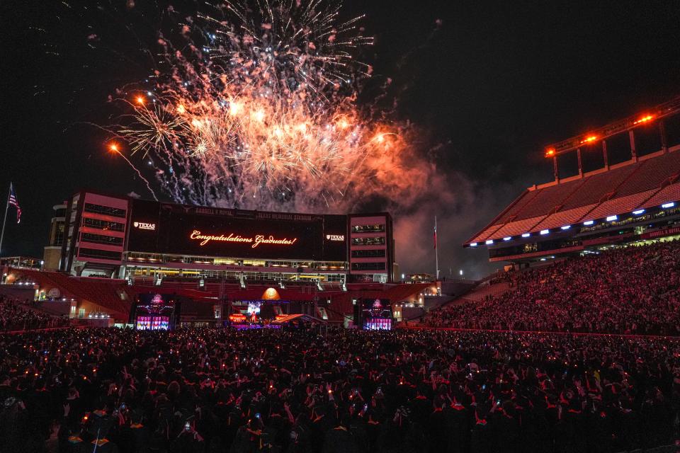 Fireworks light up the sky above Royal-Memorial Stadium at the commencement ceremony.