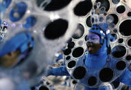 <p>Revellers from Portela Samba school perform during the second night of the Carnival parade at the Sambadrome in Rio de Janeiro, Brazil, Feb. 12, 2018. (Photo: Pilar Olivares/Reuters) </p>