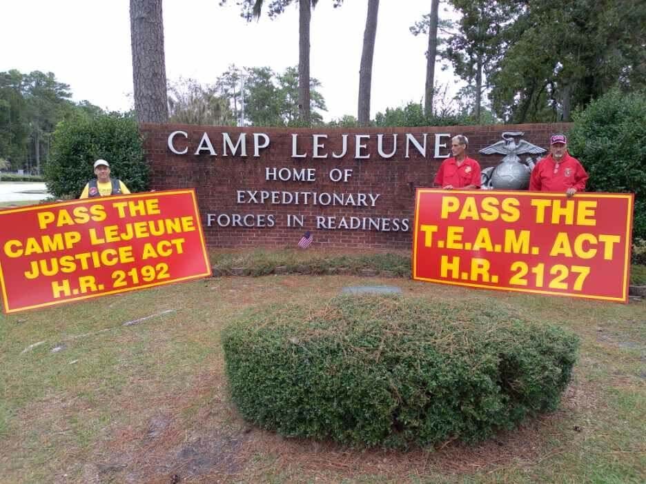 Camp Lejeune toxic water survivors, from left, Jimmy Hollingsworth, Curtis Crawford and Brian Amburgey stand outside Camp Lejeune while in Jacksonville for an event, Oct. 10, 2021.