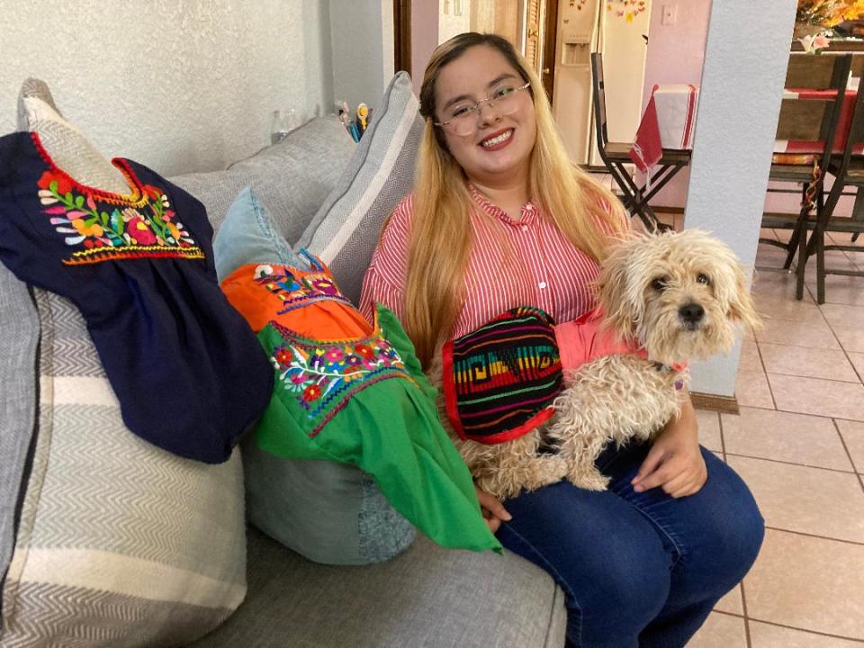 El Paso Alejandra Marquez, shown with her model dog, Lila, sells dog attire with a Mexican touch, such as folklorico dresses, guayaberas and sarapes. Dresses and guayaberas cost $15 on up.