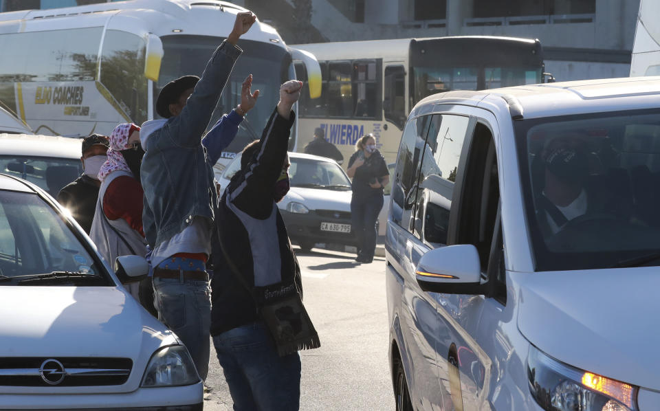 Tour operators take part in a protest in Cape Town, South Africa, Friday July 31, 2020. Various tourism operators staged a slow drive protest as they struggle to make ends meet under the COVID-19 lockdown regulations. (Photo/Nardus Engelbrecht)