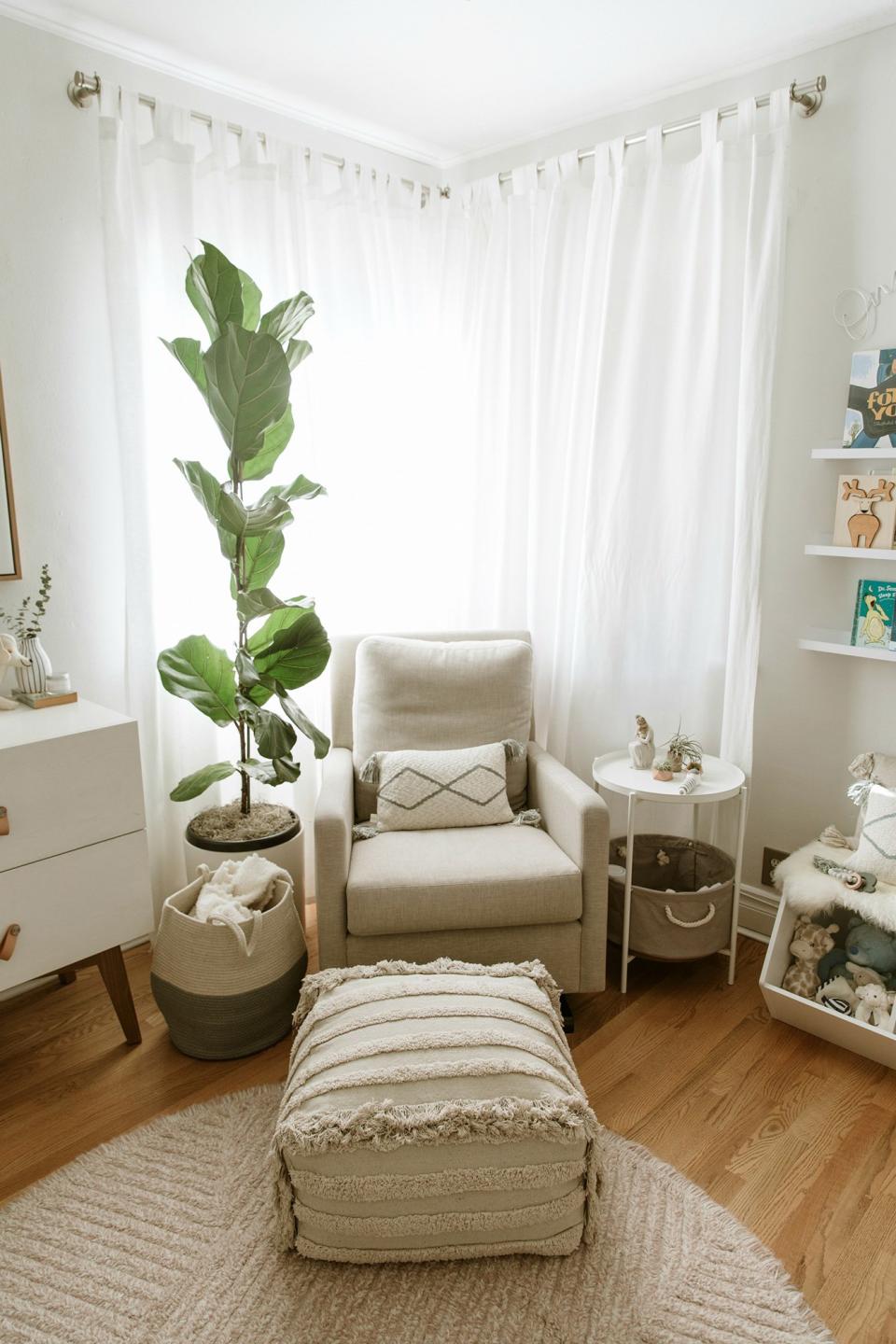 I wanted to create a space that I’d feel comfortable in. After all, I was the one nursing over eight hours a day! I started with the Como glider from <a href="https://montedesign.com/" rel="nofollow noopener" target="_blank" data-ylk="slk:Monte Design;elm:context_link;itc:0;sec:content-canvas" class="link ">Monte Design</a>. Incredibly comfortable! The side table I got at <a href="http://www.anrdoezrs.net/links/8029122/type/dlg/sid/PEO,InsideActressCamilleGuaty'sDreamyNurseryforHerNewbornSonMorrisonRafael,mchiupeople,Unc,Gal,7425263,201911,I/https://www.wayfair.com/furniture/pdp/trent-austin-design-bluxome-tray-table-ntjs1014.html?piid=42970853" rel="nofollow noopener" target="_blank" data-ylk="slk:Wayfair for less than $100;elm:context_link;itc:0;sec:content-canvas" class="link ">Wayfair for less than $100</a>. Having a basket with all of my nursing needs was essential (breast pump, nipple cream, nipple pads, burp cloths). The fiddle leaf fig was a perfect addition to incorporate greenery and height to the room. A tip from <a href="https://www.ellmoredesign.com/" rel="nofollow noopener" target="_blank" data-ylk="slk:Ellmore Design;elm:context_link;itc:0;sec:content-canvas" class="link ">Ellmore Design</a>: “Hanging your curtains at the highest point will make the room feel taller and more expansive! A sense of space always makes a room more enjoyable.”