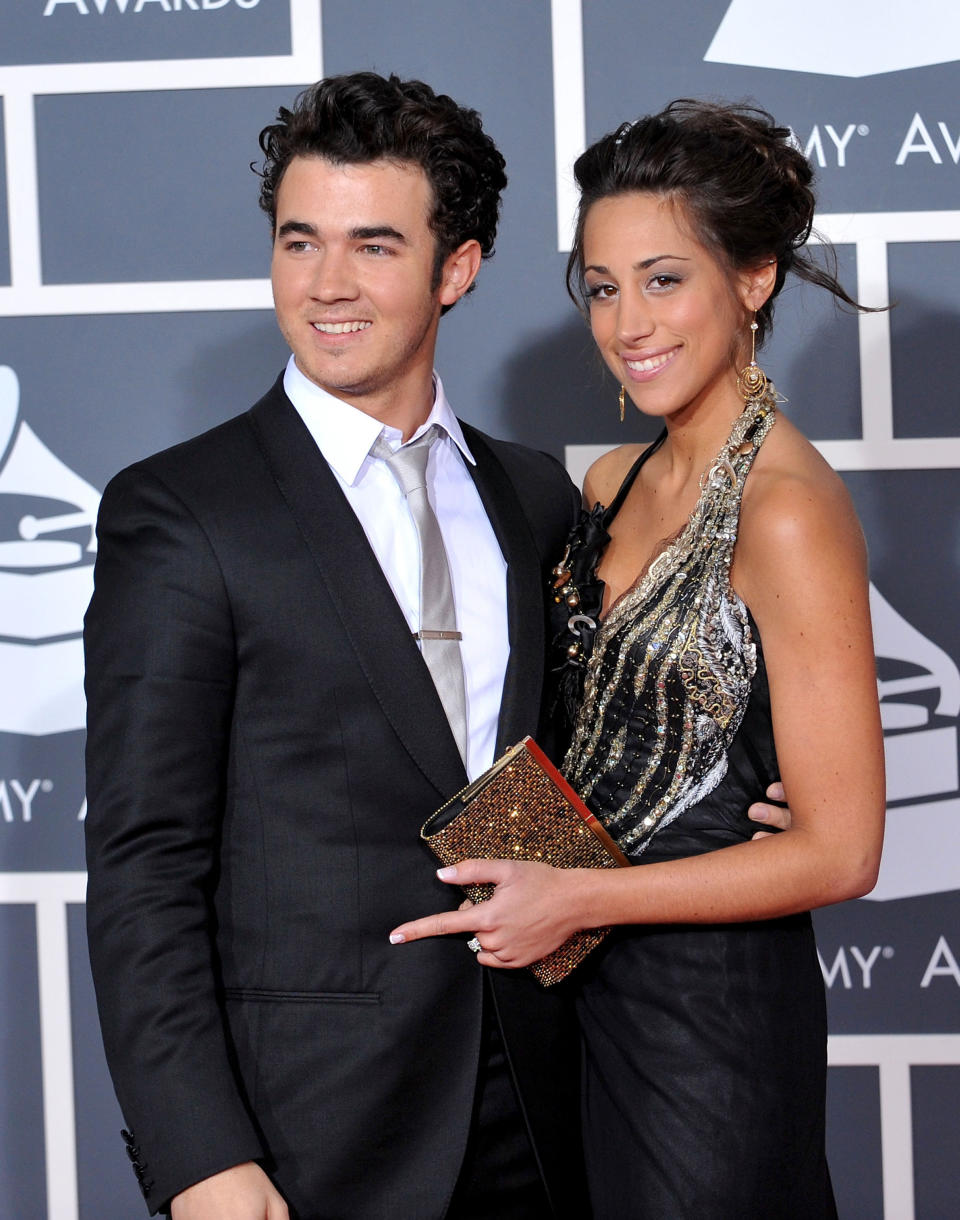 Kevin with his arm around Danielle&#39;s waist