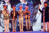 Members of China's all-girl "boyband" FFC-Acrush appear on the stage during their maiden press conference in Beijing, China April 28, 2017. REUTERS/Damir Sagolj/Files