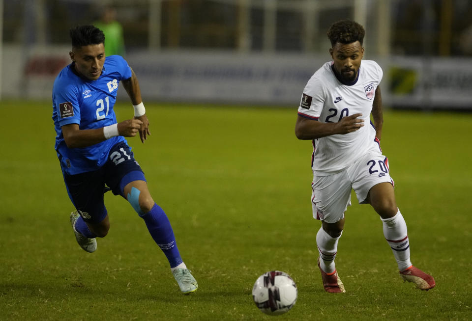 El Salvador's Bryan Tamacas, left, and United States's Konrad de la Fuente go for the ball during a qualifying soccer match for the FIFA World Cup Qatar 2022 at Cuscatlan stadium in San Salvador, El Salvador, Thursday, Sept. 2, 2021. (AP Photo/Moises Castillo)