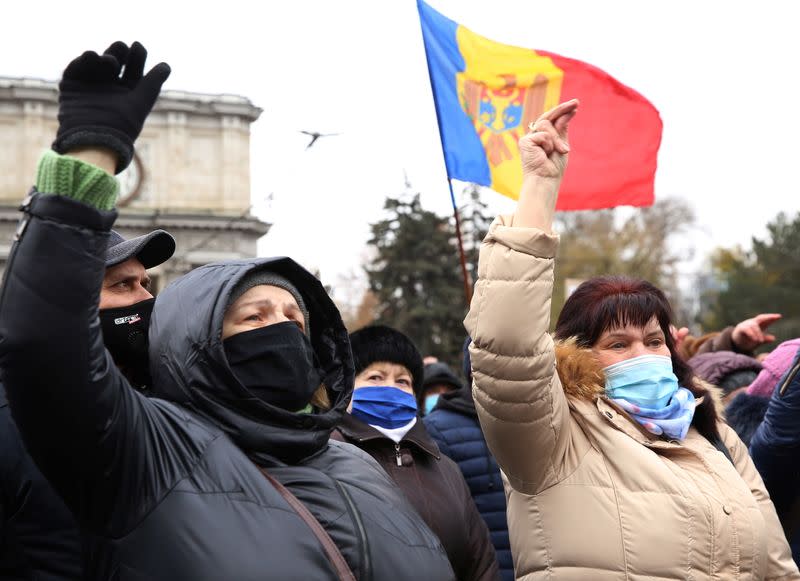 Supporters of Moldovan President-elect Maia Sandu attend a rally to demand the government to resign and to hold early parliamentary elections in Chisinau