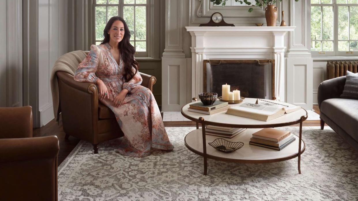 joanna gaines sitting on a chair