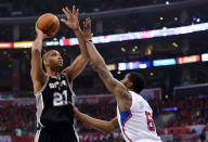 LOS ANGELES, CA - MAY 20: Tim Duncan #21 of the San Antonio Spurs shoots the ball over DeAndre Jordan #6 of the Los Angeles Clippers in the first quarter in Game Four of the Western Conference Semifinals in the 2012 NBA Playoffs on May 20, 2011 at Staples Center in Los Angeles, California. NOTE TO USER: User expressly acknowledges and agrees that, by downloading and or using this photograph, User is consenting to the terms and conditions of the Getty Images License Agreement. (Photo by Harry How/Getty Images)