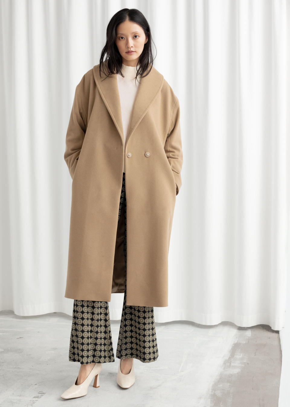 Get the <a href="https://www.stories.com/en_usd/clothing/jackets-coats/woolcoats/product.belted-wool-blend-long-coat-beige.0791991001.html" target="_blank" rel="noopener noreferrer">&amp; Other Stories wool blend long coat for $249&nbsp;</a>