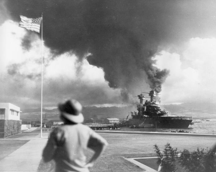 FILE - American ships burn during the Japanese attack on Pearl Harbor, Hawaii, Dec. 7, 1941. A few centenarian survivors of the attack on Pearl Harbor are expected to gather at the scene of the Japanese bombing on Wednesday, Dec. 7, 2022, to remember those who perished 81 years ago. (AP Photo/File)
