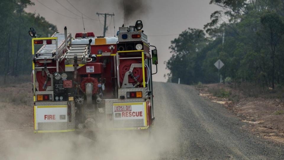 A hundred firefighters have arrived from NSW to help exhausted crews battle the Queensland inferno