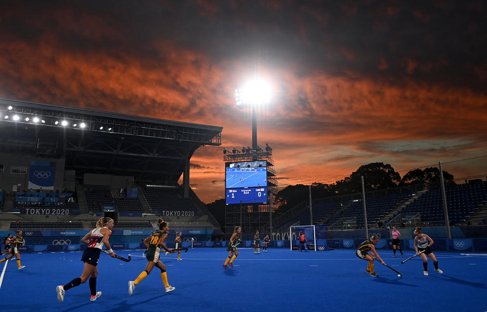 <p>Players from South Africa and Britain compete during the women's pool A match of the field hockey competition on July 26.</p>