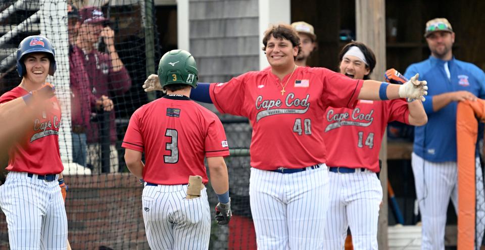 Eric Snow (3) is welcomed by his Hyannis teammates after his home run against Falmouth in Cape Cod League playoff action on Friday.