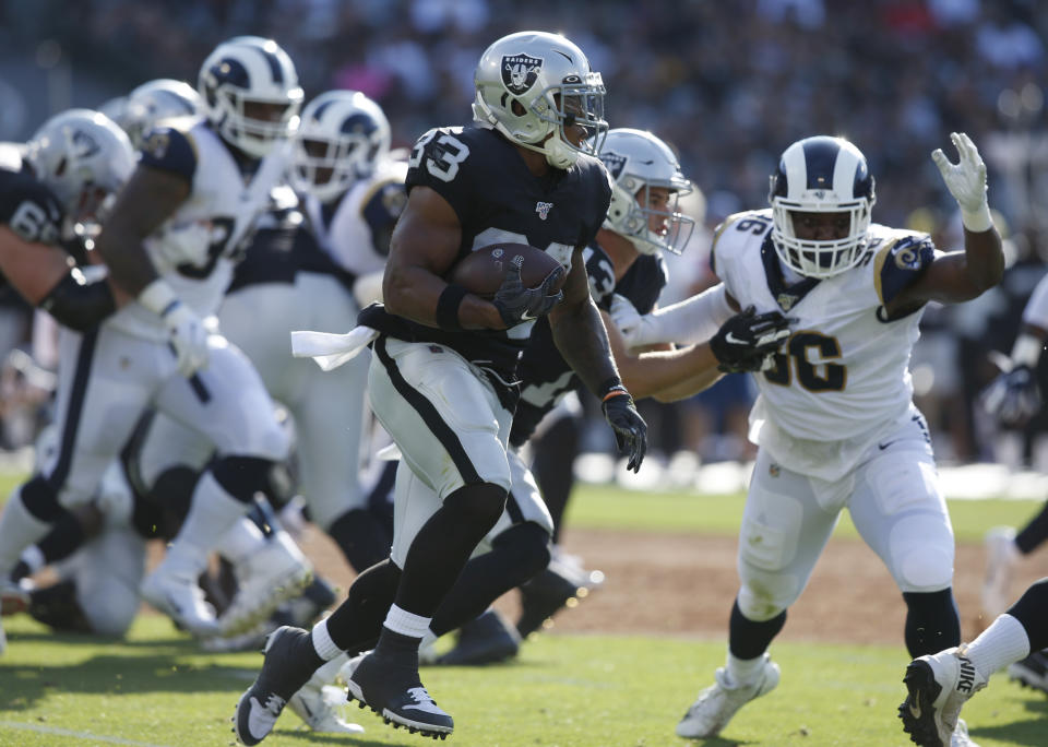 Oakland Raiders' DeAndre Washington (33) runs against the Los Angeles Rams during the first half of a preseason NFL football game Saturday, Aug. 10, 2019, in Oakland, Calif. (AP Photo/Rich Pedroncelli)