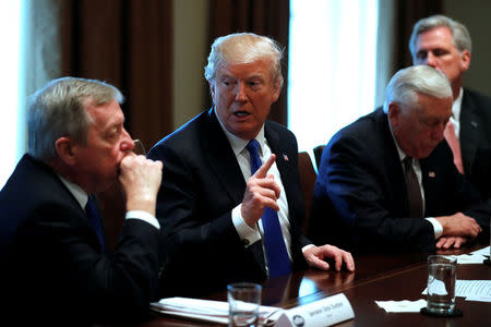 U.S. President Donald Trump, flanked by U.S. Senator Dick Durbin (D-IL), Representative Steny Hoyer (D-MD) and House Majority Leader Kevin McCarthy (R-CA), holds a bipartisan meeting with legislators on immigration reform at the White House in Washington, U.S. January 9, 2018. REUTERS/Jonathan Ernst