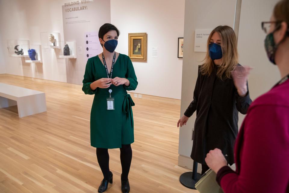 Museum staff talks about a new section at Newfields, a second floor display they call "global thematic display," on Tuesday, Jan. 25, 2022. The area mixes art from different parts of the world, and from different eras into thematic areas. 