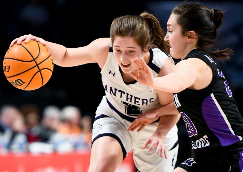 Prattville Christian’s Ella Jane Connell (2) drives against Susan Moore's Marisa Bryan (20) during their AHSAA Class 3A State Championship game at Legacy Arena in Birmingham, Ala., on Friday March 4, 2022.