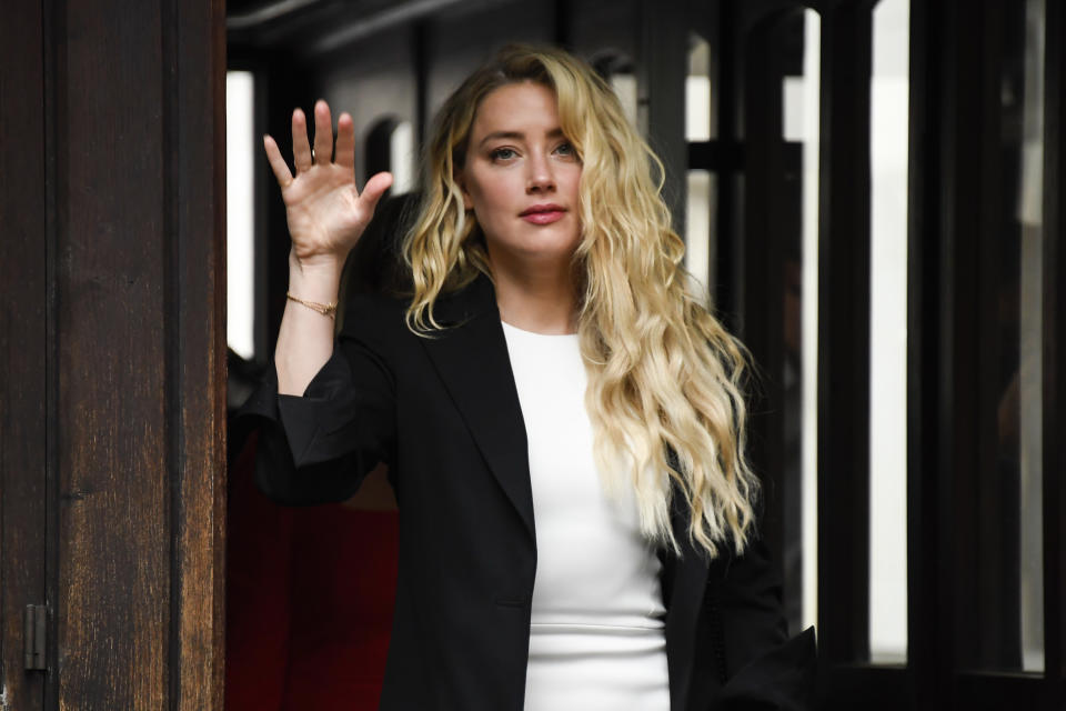 Amber Heard arrives at High Court in London, Monday, July 27, 2020. Hollywood actor Johnny Depp is suing News Group Newspapers over a story about his former wife Amber Heard, published in The Sun in 2018 which branded him a 'wife beater', a claim he denies. (AP Photo/Alberto Pezzali)