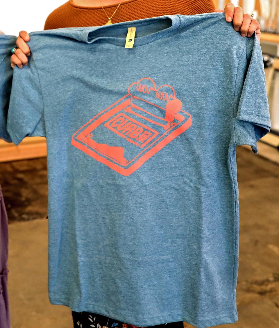 A T-shirt printed by Curbside Apparel.