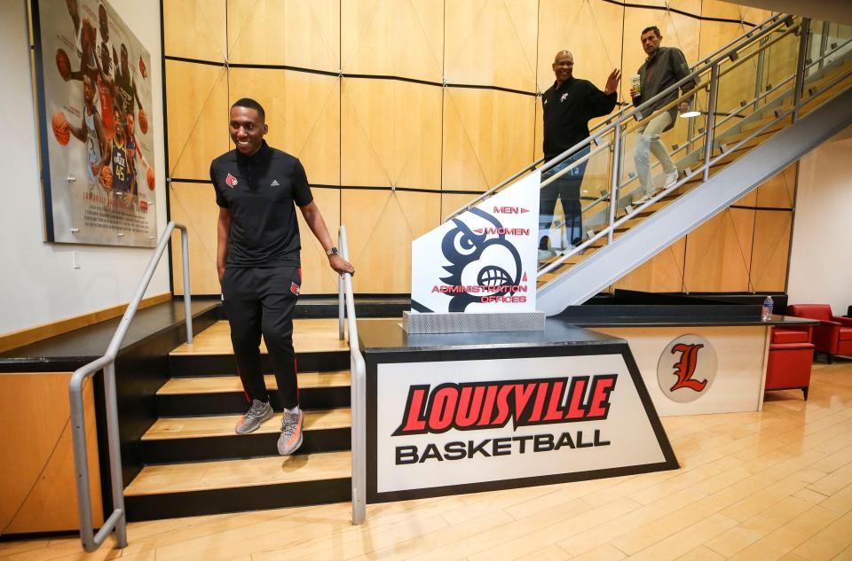 New assistant basketball coach Nolan Smith walks down the steps at the Kueber Center as men's head coach Kenny Payne and interim athletic director Josh Heird follow before Smith's official introduction at Monday afternoon's press conference. April 11, 2022