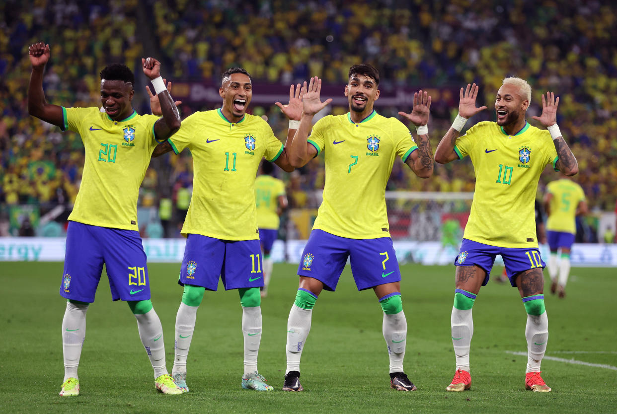 Neymar celebrates with Raphinha, Lucas Paqueta and Vinicius Junior after scoring Brazil's second goal Monday against South Korea. (Photo by Francois Nel/Getty Images)