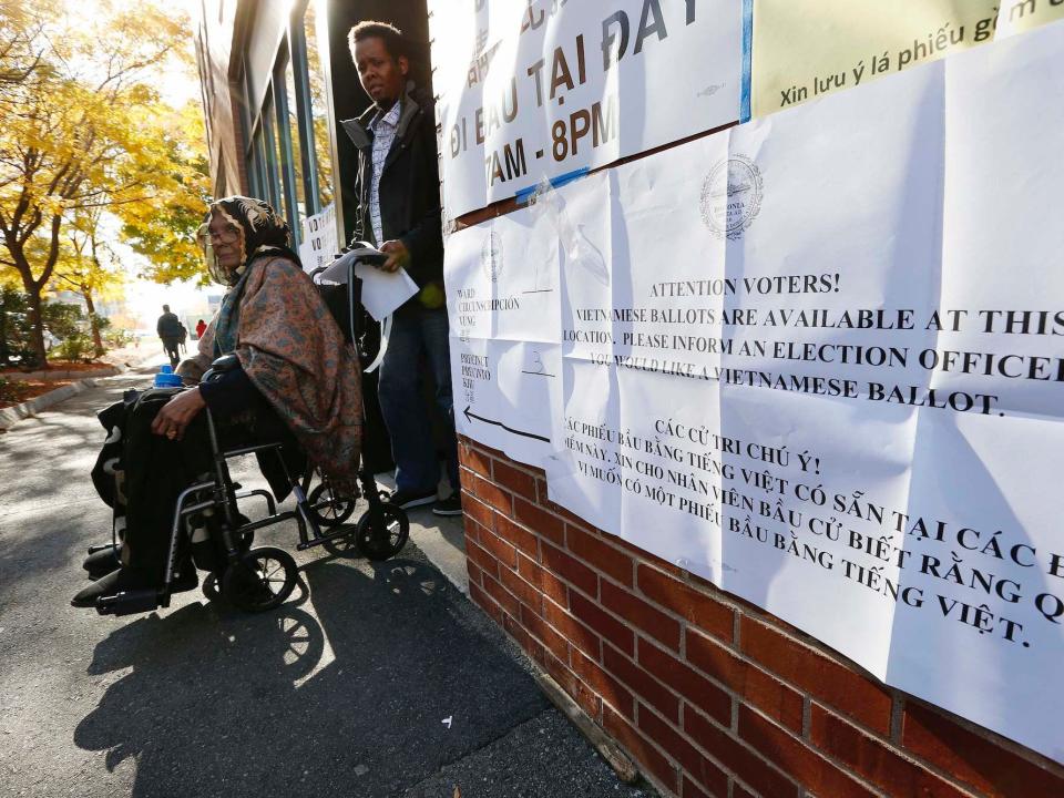 A woman who did not wish to be identified leaves a polling station after having voted in the East Boston neighborhood of Boston, Massachusetts.