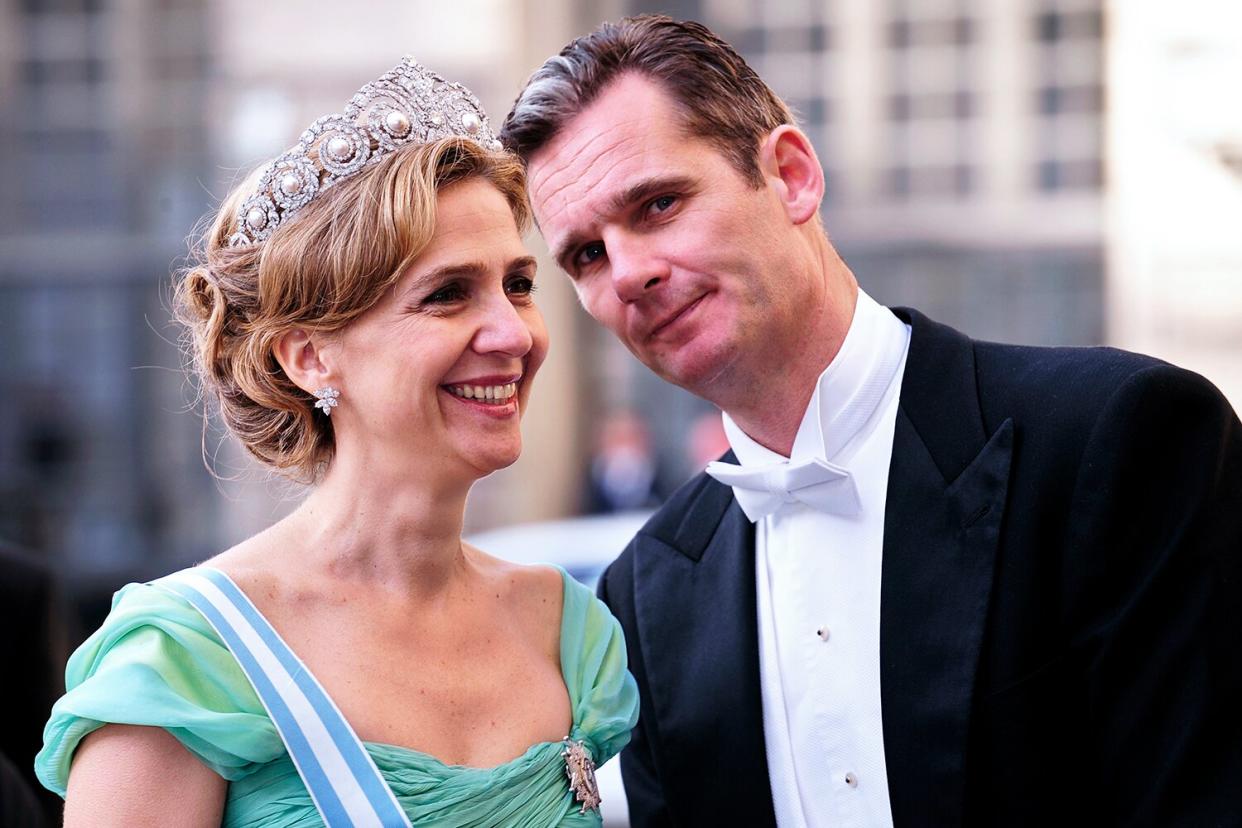 A picture taken on June 19, 2010 shows Infanta Cristina of Spain (L) and her husband Inaki Urdangarin arriving at the wedding banquet of newly-wed Swedish royal couple, Crown Princess Victoria and her husband Daniel Westling at the Royal Palace of Stockholm.
