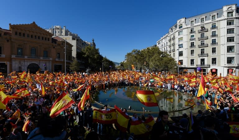 As many as one million Spaniards rallied in Catalonia's capital Barcelona, waving national and European flags and chanting "Viva Espana!" on October 29