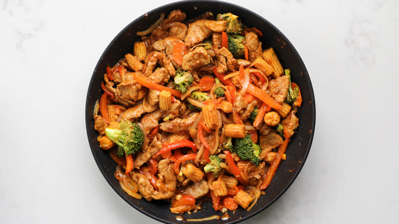 saucy pork stir-fry in skillet