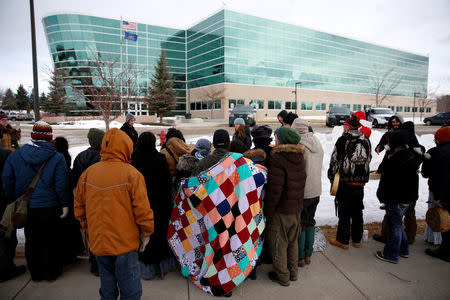 Opponents of the Dakota Access oil pipeline rally outside the Bank of North Dakota in Bismarck, North Dakota, U.S., January 31, 2017. REUTERS/Terray Sylvester