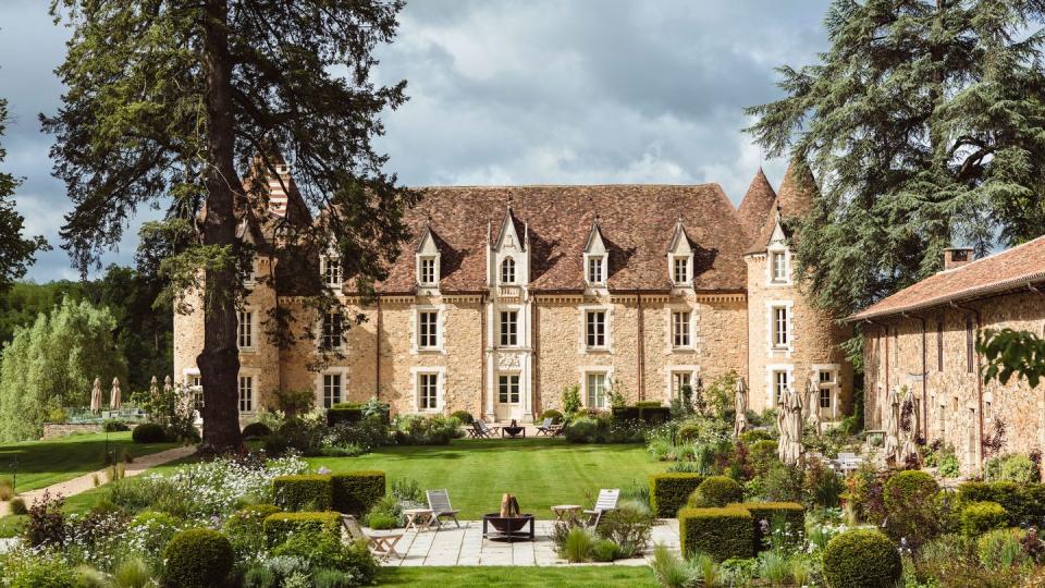 a large house with a garden in front of it