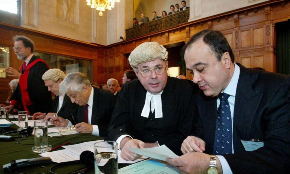 James Crawford, foreground left, talking to Nasser Al-Kidwa at the International Court of Justice in The Hague, Netherlands, 2004.