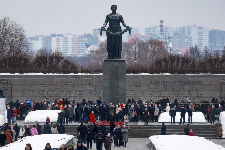 People attend a wreath laying commemoration ceremony at the Piskaryovskoye Cemetery where most of the Leningrad Siege victims were buried during World War II, in St.Petersburg, Russia, Saturday, Jan. 27, 2024. The ceremony marked the 80th anniversary of the battle that lifted the Siege of Leningrad. The Nazi siege of Leningrad, now named St. Petersburg, was fully lifted by the Red Army on Jan. 27, 1944. More than 1 million people died mainly from starvation during the nearly 900-day siege. (Vyacheslav Prokofyev, Sputnik, Kremlin Pool Photo via AP)