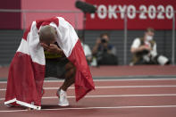 Damian Warner, of Canada reacts after he won the gold medal for the decathlon at the 2020 Summer Olympics, Thursday, Aug. 5, 2021, in Tokyo. (AP Photo/Matthias Schrader)