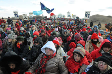 Protesters sit in silence during a protest against plans to pass the Dakota Access pipeline near the Standing Rock Indian Reservation, near Cannon Ball, North Dakota, U.S. November 18, 2016. REUTERS/Stephanie Keith