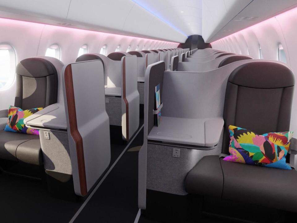 Rendering of Aisle Class on BermudAir with brown seats and colorful pillows on the first row.