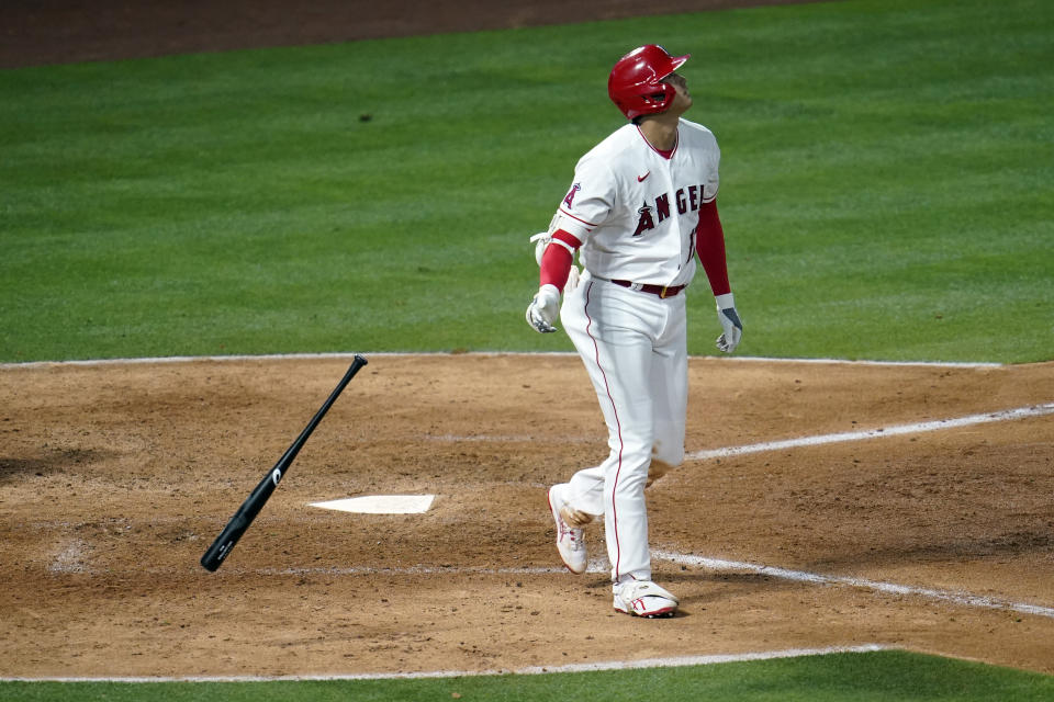 Los Angeles Angels' Shohei Ohtani drops his bat as he hits a two-run home run during the sixth inning of a baseball game against the Tampa Bay Rays Monday, May 3, 2021, in Anaheim, Calif. (AP Photo/Marcio Jose Sanchez)