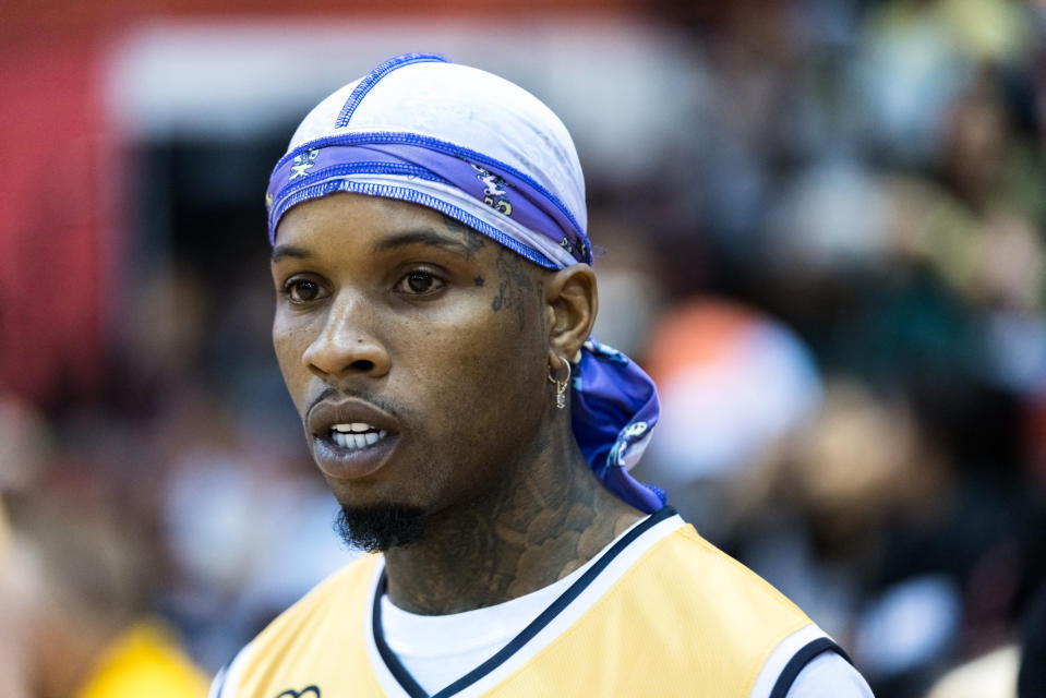 Tory Lanez wearing purple du-rag.