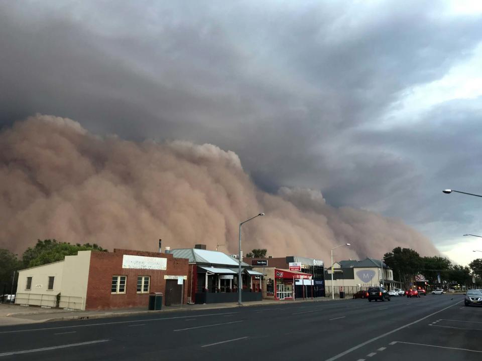 A dust cloud billows over a street in Dubbo, Australia, 400 kms (248 miles) west of Sydney: AP