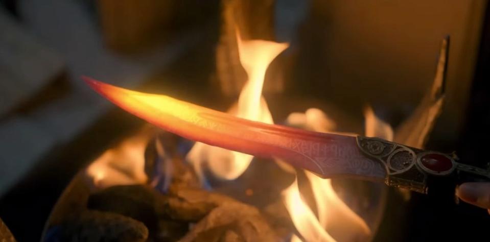 The dagger heated with fire showing Valyrian writing on it