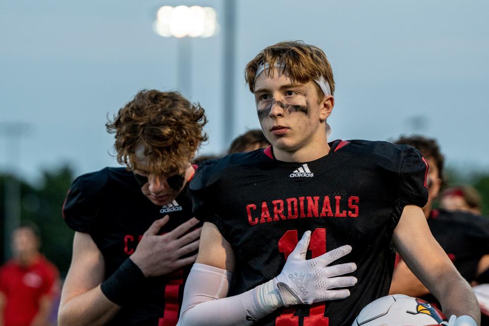 Westwood High School hosts River Dell in a football game in Washington Township on Friday September 16, 2022. The Westwood Cardinals keep their hands to their hearts during the National anthem. 