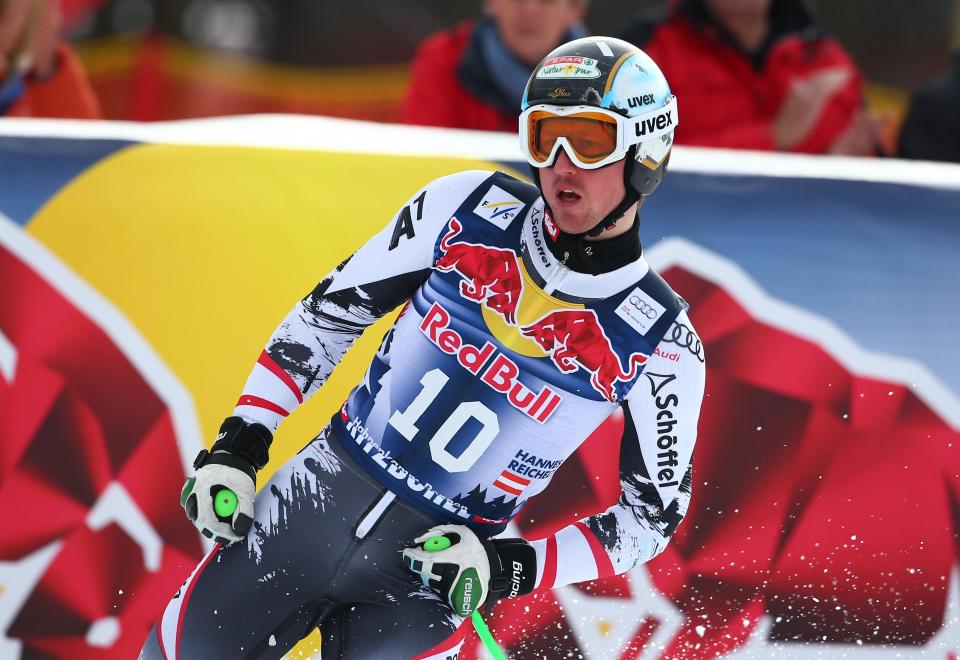 Hannes Reichelt of Austria gets to the finish area after completing an alpine ski men's World Cup downhill training in Kitzbuehel, Austria, Thursday, Jan. 23, 2014. (AP Photo/Giovanni Auletta)