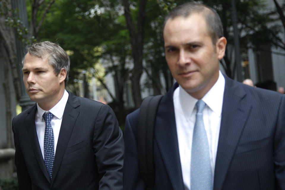 Shepard Fairey, left, leaves Manhattan Federal court in New York with his attorney, Dan Gitner, Friday, Sept. 7, 2012. Fairey, who created the "HOPE" poster that came to symbolize Barack Obama's 2008 presidential campaign, was sentenced Friday to two years of probation and 300 hours of community service for destroying and fabricating documents in a civil lawsuit pertaining to The Associated Press photograph he relied upon to make the poster. (AP Photo/Mary Altaffer)