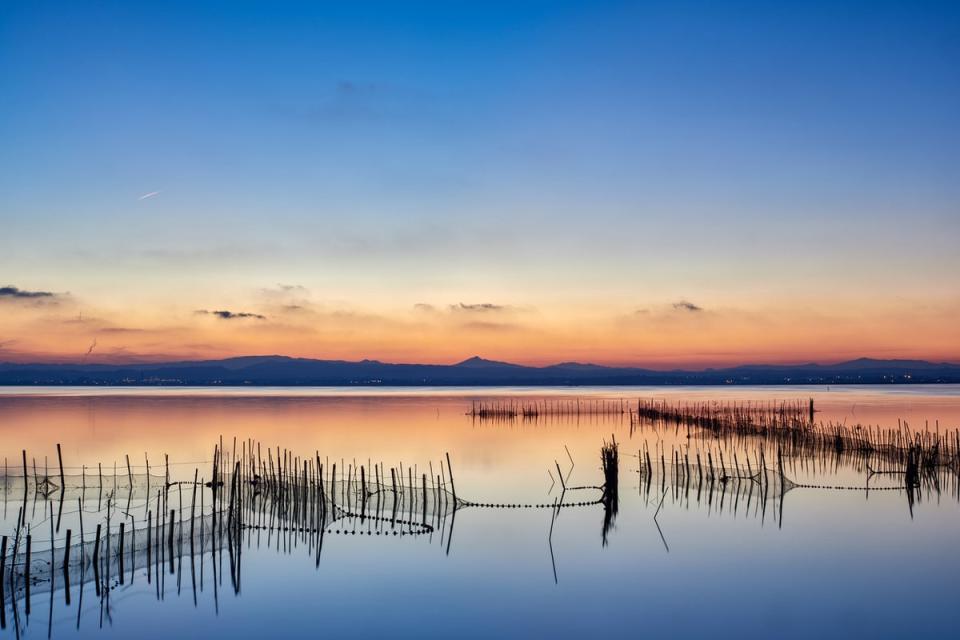 Sunsets don’t get much better than on the lagoon within Albufera Natural Park (Getty Images/iStockphoto)