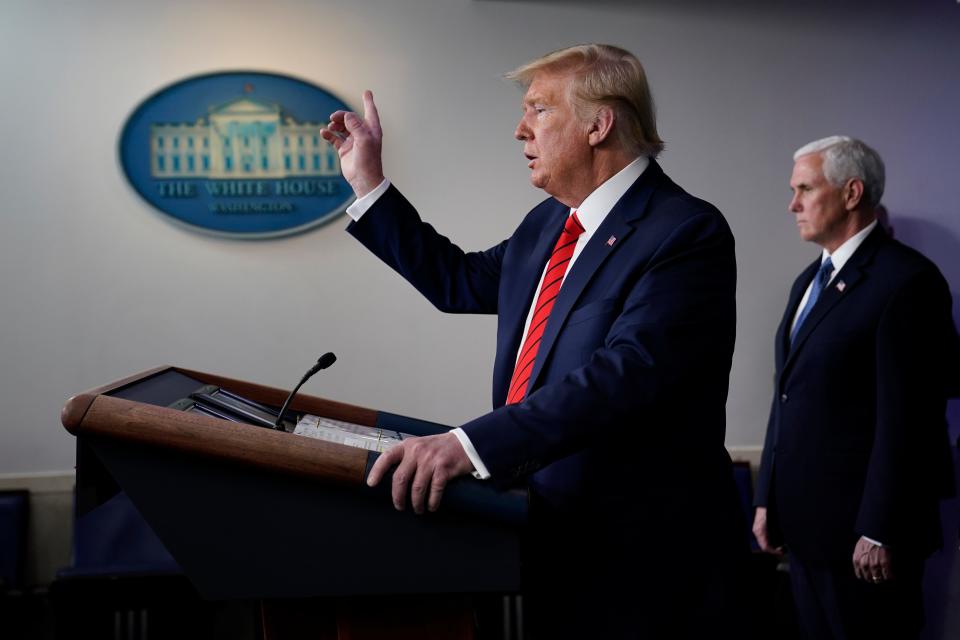 President Donald Trump speaks during press briefing with the coronavirus task force, at the White House, Thursday, March 19, 2020, in Washington. Vice President Mike Pence listens at right.